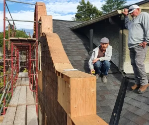 Restoration Team Repairing Roof and Architectural Details on Historic Portland Home