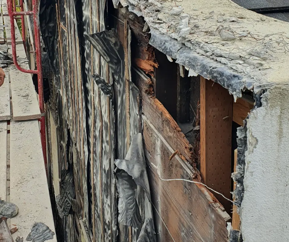 Assessing Water Damage on Stucco Facade of a Historic Home in Portland