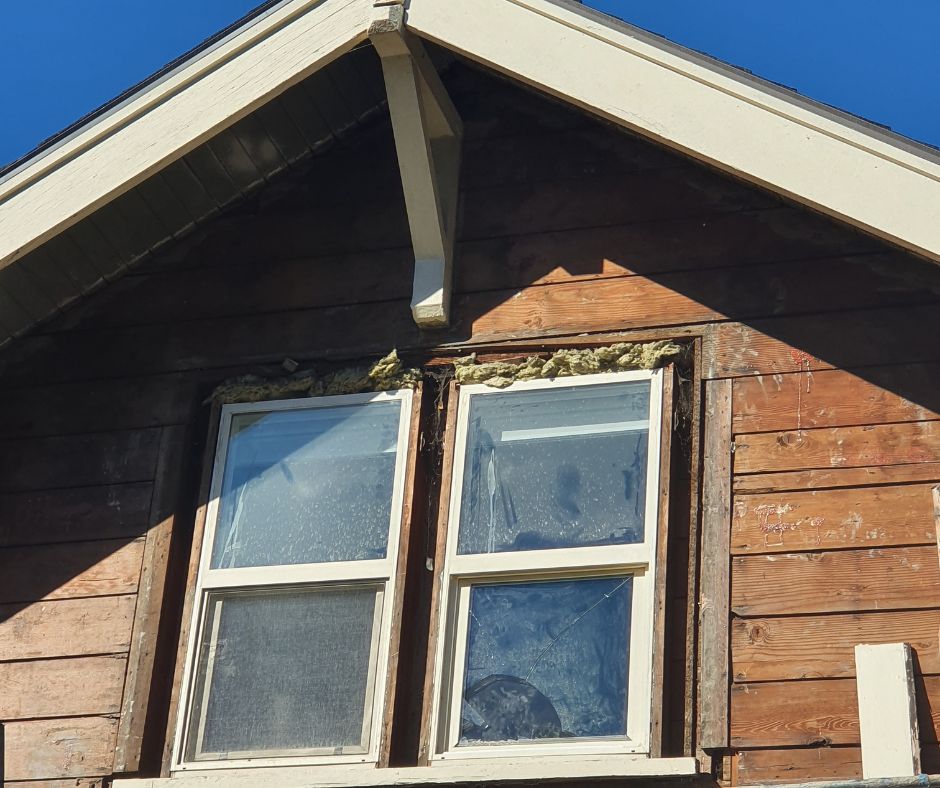 A newly installed window with enhanced insulation and sealing after replacing an old one during rainy weather.