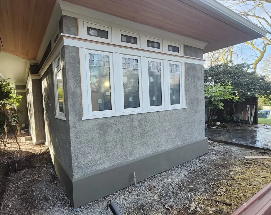 Finished historic stucco addition with matched pebbledash texture in Portland, Oregon